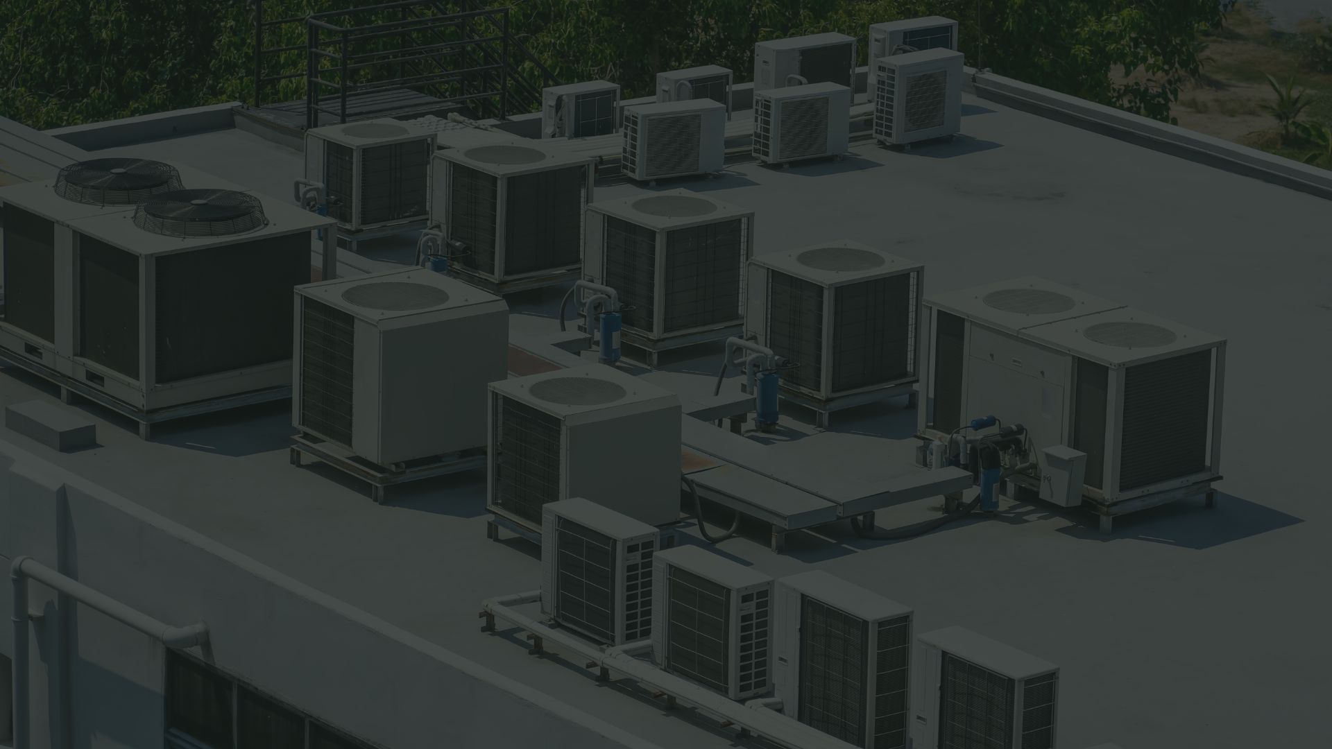 Commercial HVAC technicians servicing rooftop units